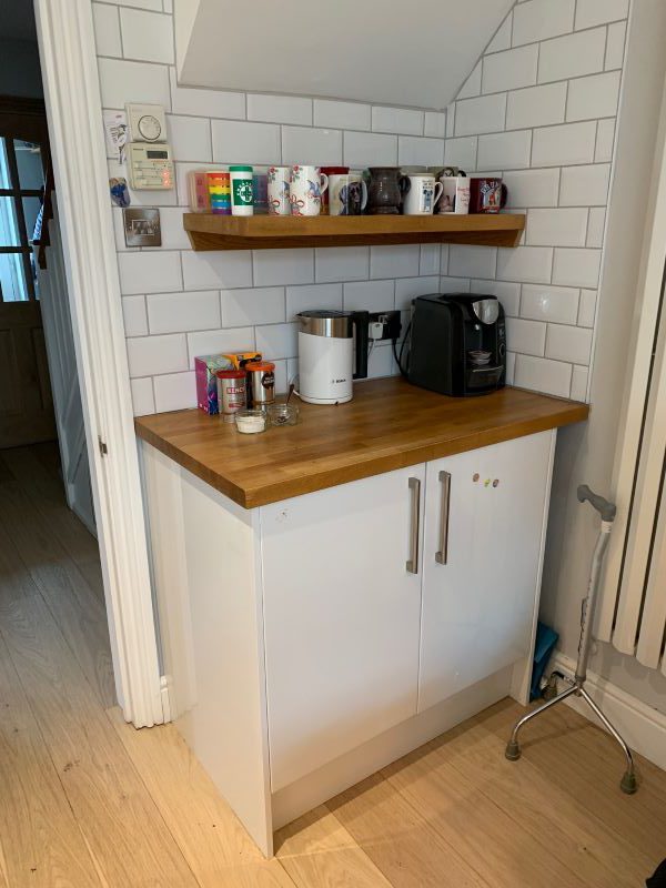 kitchen 7 An organised kitchen cupboard. With cereals in one section, tupperware in another, and cooking implements on their own shelf