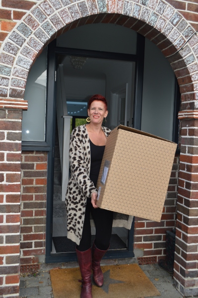 me moving box Roxy organising content into boxes, standing inside a room